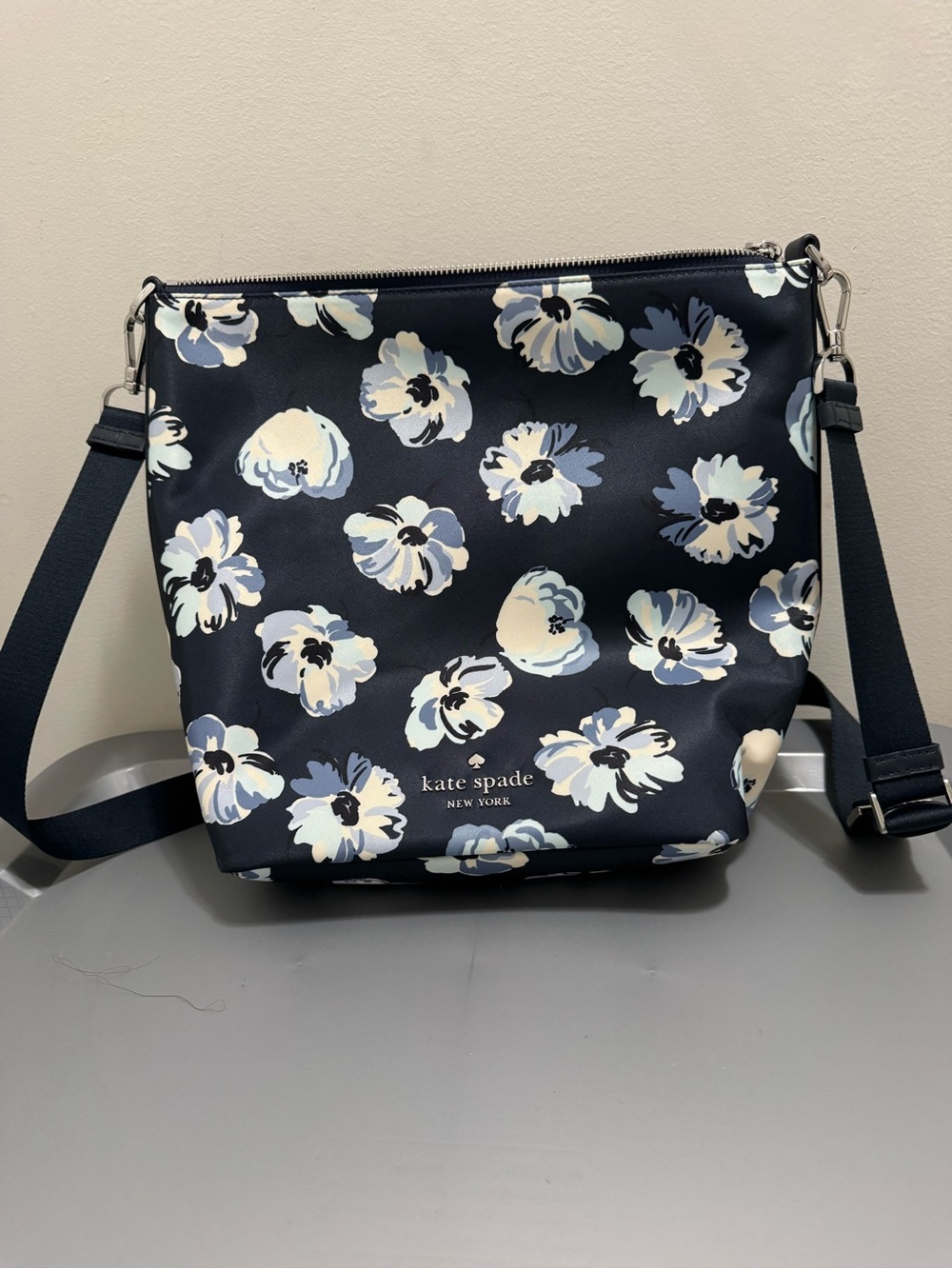 kate spade navy floral crossbody with cream and light blue blooms